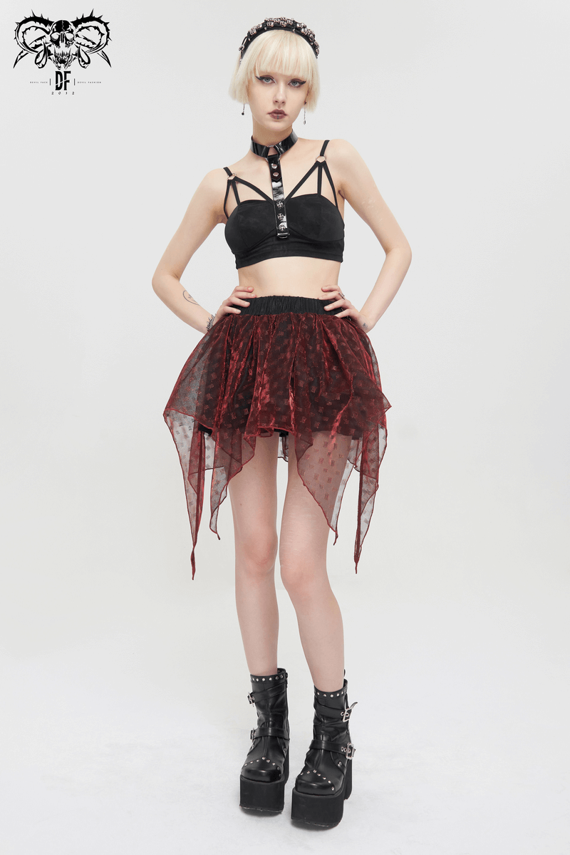 Model showcasing a gothic punk black bra with faux leather straps and a sheer red skirt, perfect for edgy fashion lovers.