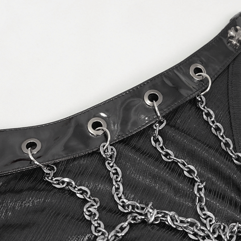 Close-up of black dress detailing with shiny chain accents and eyelets in gothic style, perfect for edgy fashion lovers.