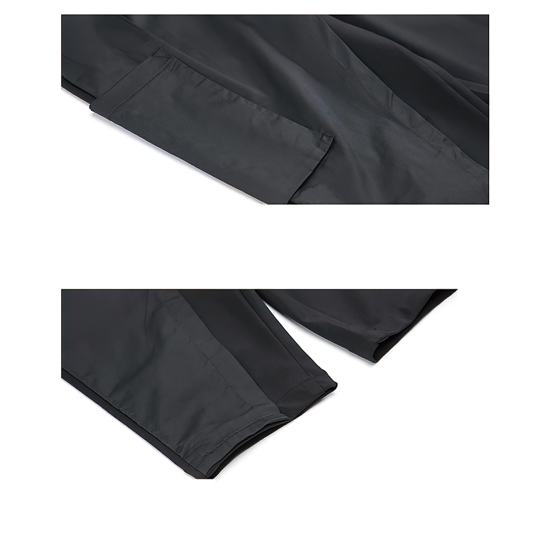 Close-up of black spliced women's harem pants, showcasing pockets and sleek fabric details for alternative fashion lovers.