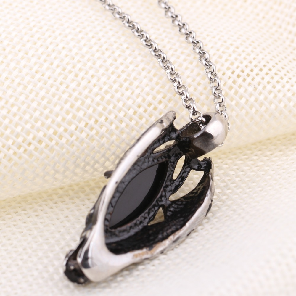 Gothic black stone dragon head pendant necklace in stainless steel, perfect for punk style or concert outfits.