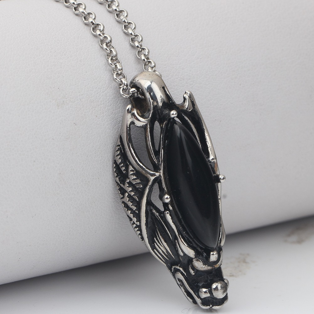 Black stone dragon head pendant necklace in stainless steel, perfect for punk style and gothic jewelry enthusiasts.