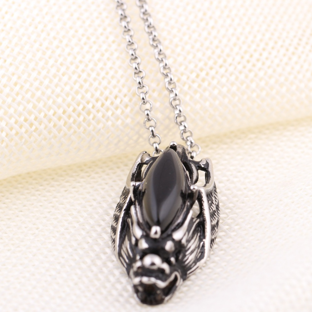 Black stone decorated dragon head pendant necklace in stainless steel for a punk, gothic look.