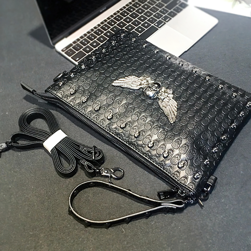 Black unisex shoulder bag with winged skull design, perfect for concerts and parties.