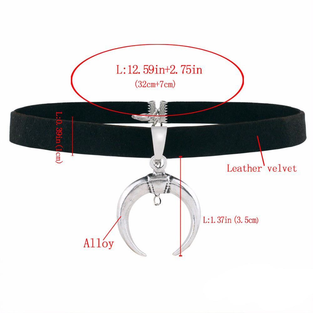 Gothic black velvet choker with silver half-moon pendant, adjustable length, perfect for edgy fashion lovers.