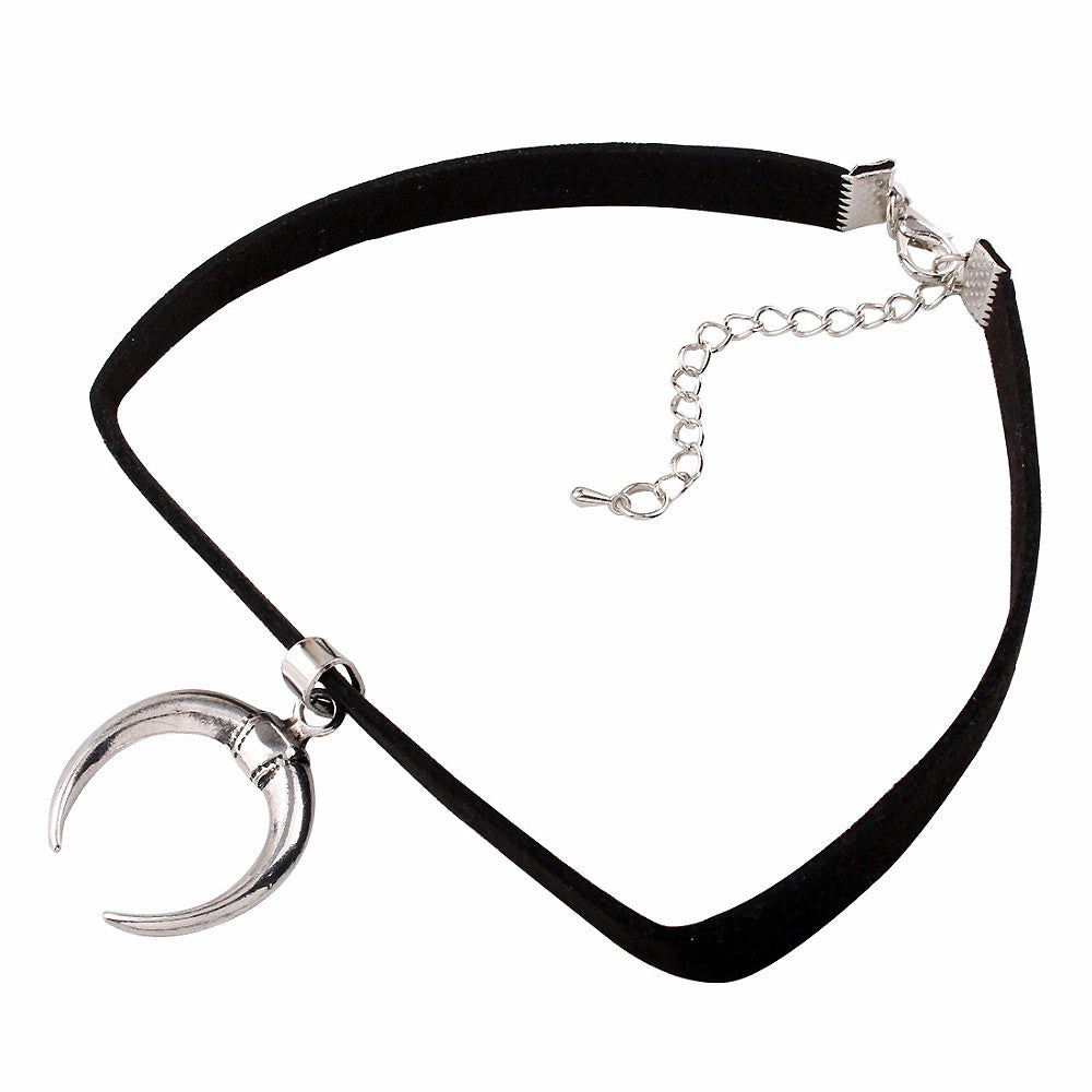 Gothic black velvet collar choker with silver half-moon pendant, perfect for edgy accessories and stylish bondage looks.