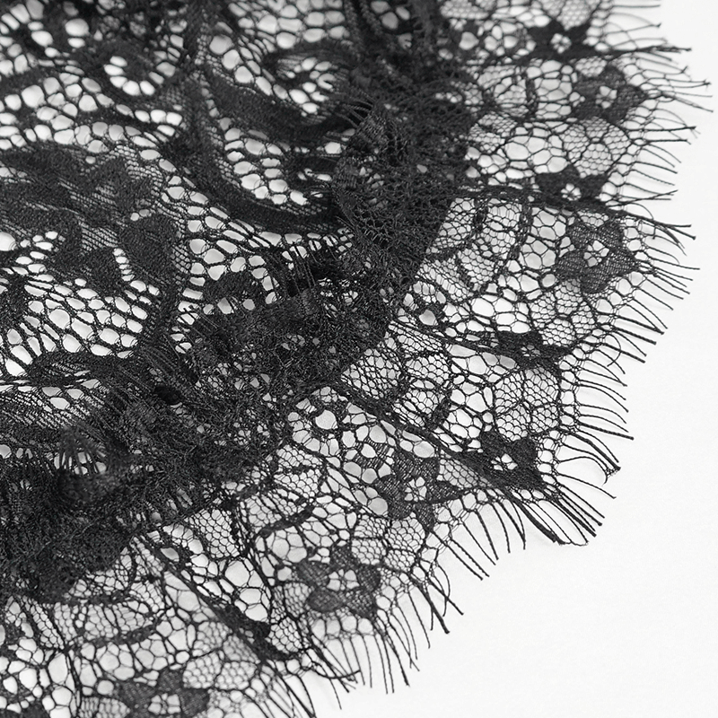 Close-up of delicate black vintage lace trim, perfect for adding elegance to gothic or casual clothing.