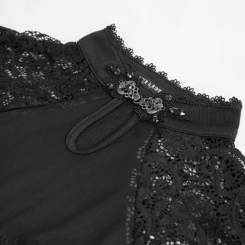 Close-up of black vintage lace details on a women's slim V-neck t-shirt, showcasing elegant design elements.