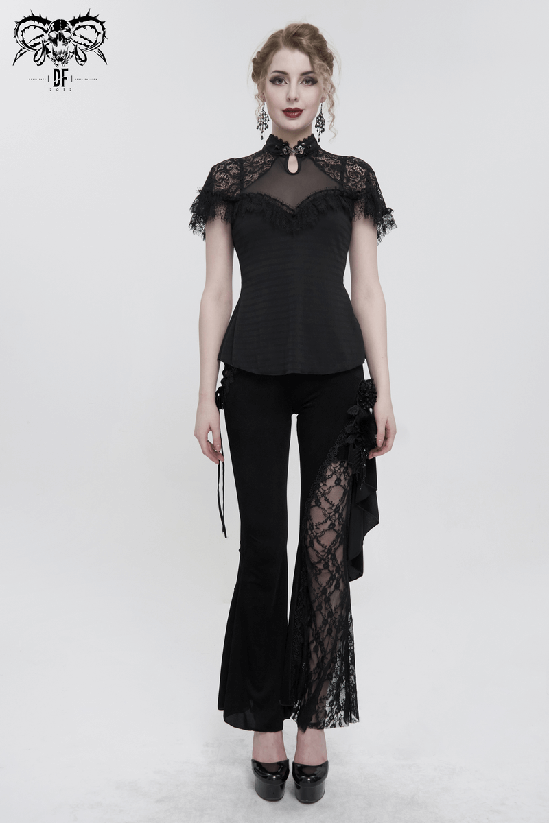 Elegant model in a black vintage lace short-sleeve top paired with stylish black pants for a gothic look.