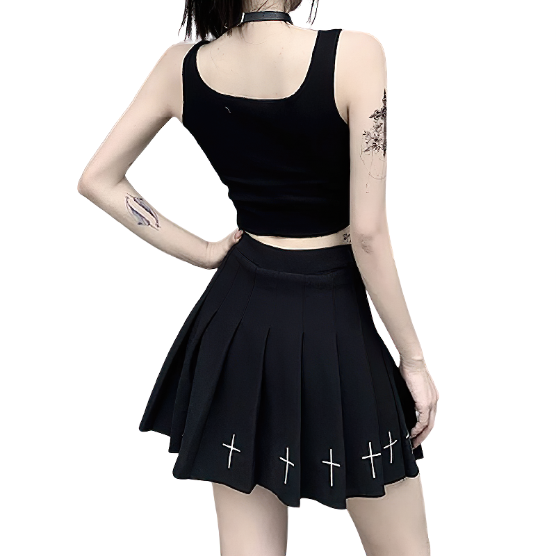 Stylish black crop tank top paired with a pleated black skirt featuring cross designs, perfect for alternative summer looks.