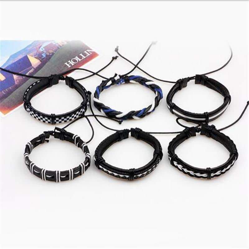Set of 6 black and white leather bracelets with braided rope, perfect for a rock-style look.