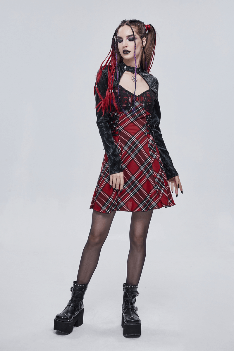 Punk-style women's checkered dress in red and black, worn with edgy accessories and platform boots.