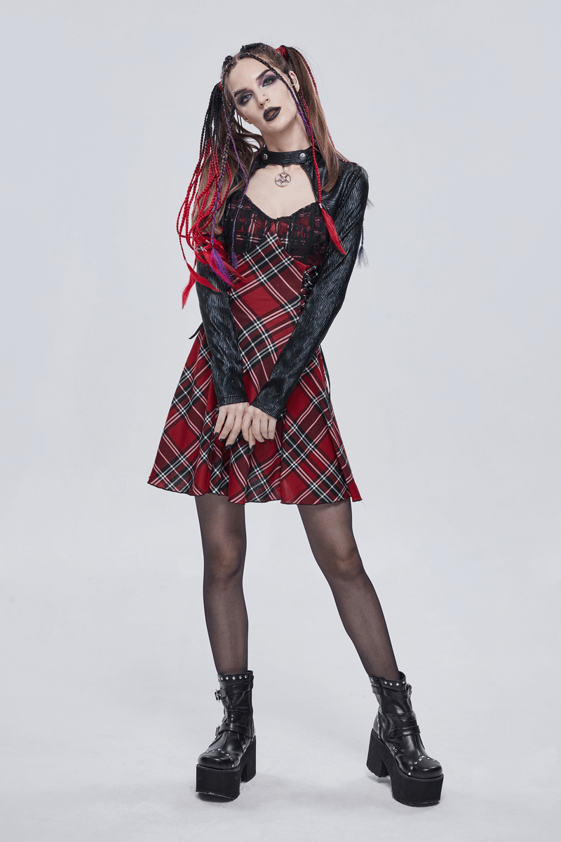 Female model in black and red punk dress with checkered print, showcasing a stylish grunge look.