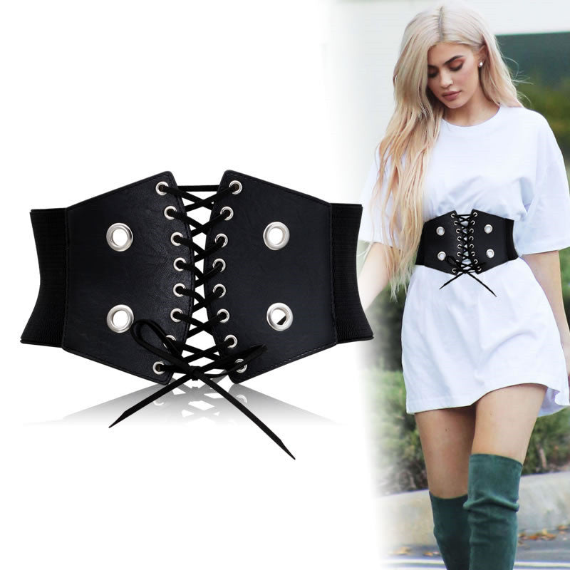 Wide black gothic belt with lace-up design and metal studs, perfect for alternative fashion lovers.