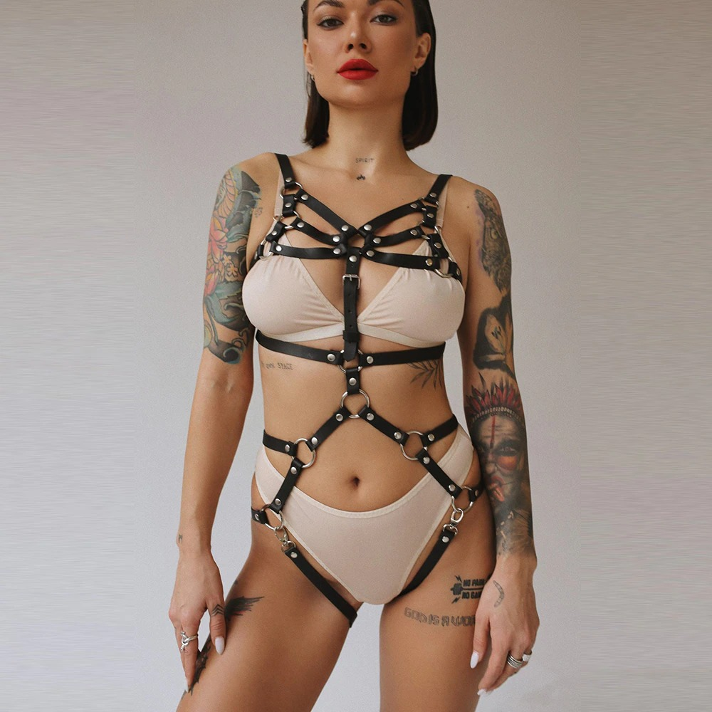 Stylish black leather body harness belt set highlighting curves and edgy fashion, perfect for bold outfits.