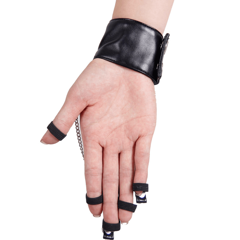 Stylish black women's leather glove with chains and skull accents, perfect for gothic fashion lovers.
