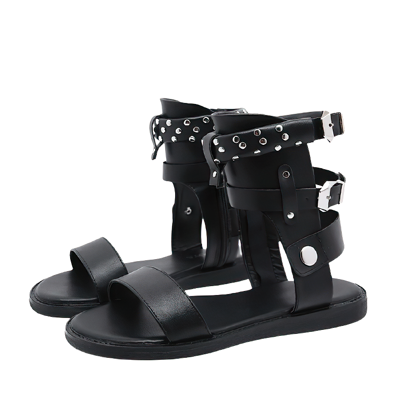 Stylish black women's flat sandals with ankle strap, metal rivets, and comfortable PU leather for summer fashion.