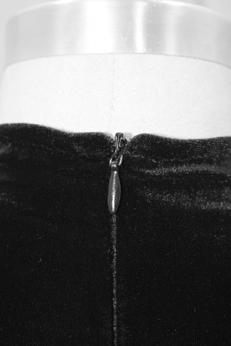 Close-up of the zipper detail on a black women's gothic mini dress showcasing elegant design and stylish accents.