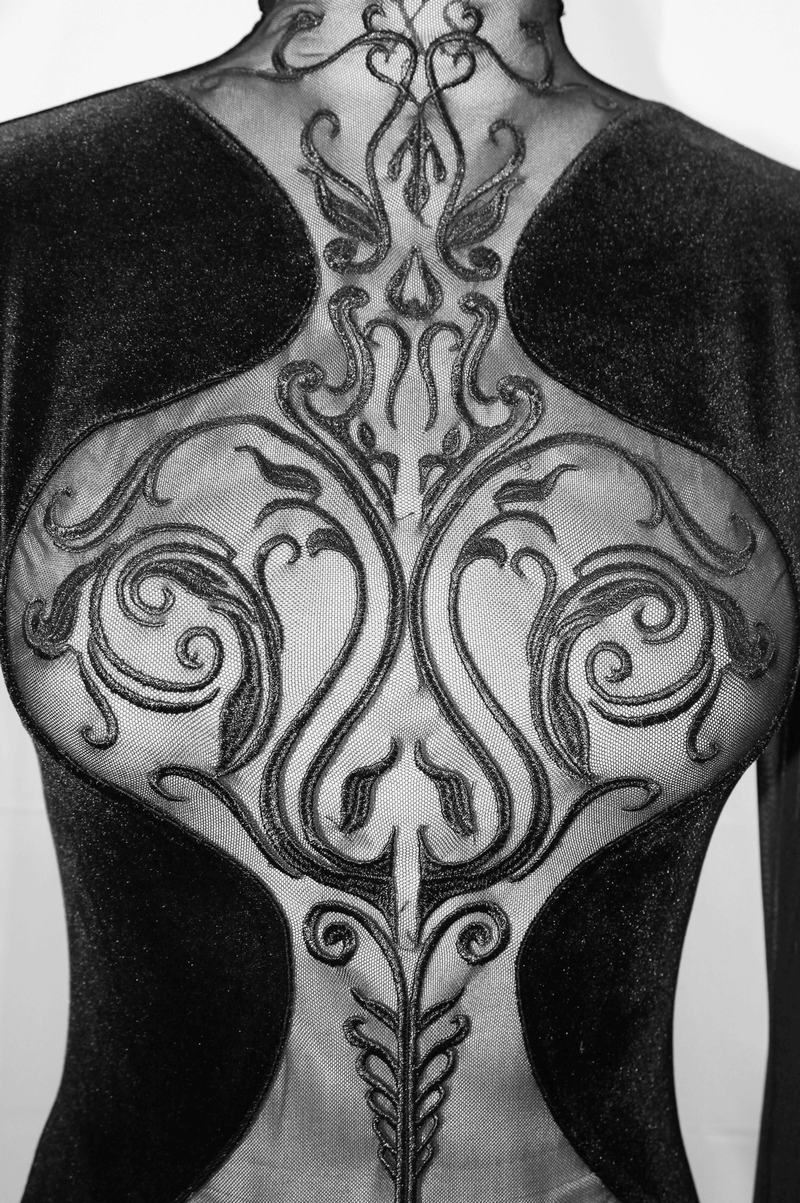 Elegant black women's gothic dress showcasing intricate transparent back design with stylish embroidery details.