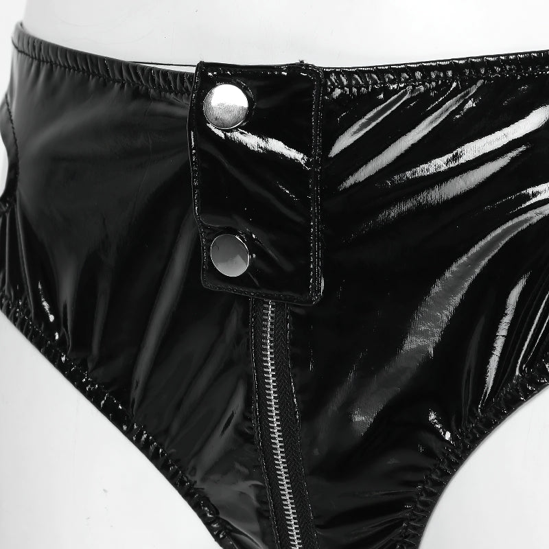 Close-up of black women's latex panties with zipper and buttons, showcasing shiny patent leather finish.