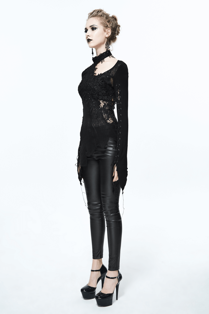 Black women's sexy lace asymmetrical top styled elegantly with skinny leather pants in a gothic fashion.