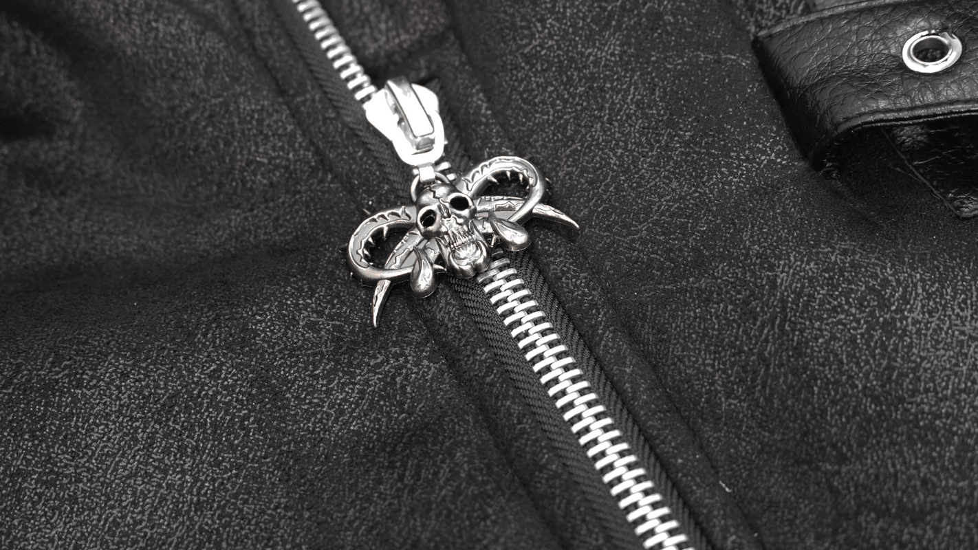Close-up of a black PU leather jacket zipper with a skull and horn charm detail, showcasing punk fashion accents.
