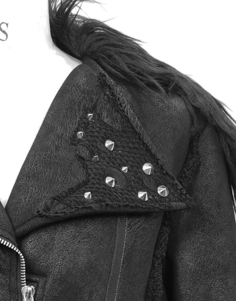 Close-up of black PU leather jacket with studs and buckles, featuring a stylish fur collar and punk design.