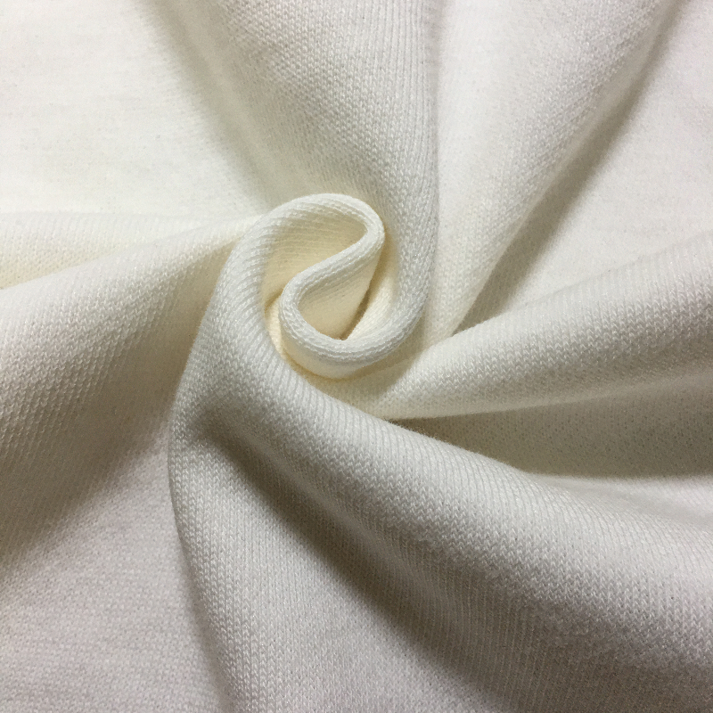 Close-up of soft white fabric, perfect for cozy clothing and versatile fashion designs.