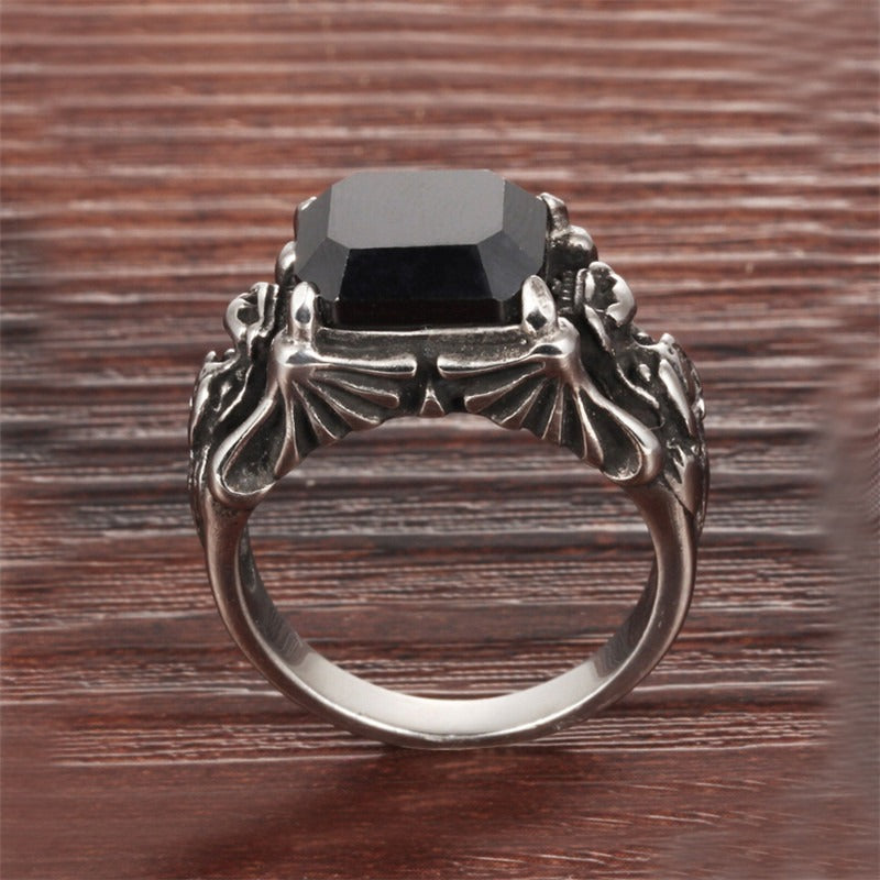 Black zircon ring in stainless steel with ornate gothic design, featuring a striking black stone centerpiece.