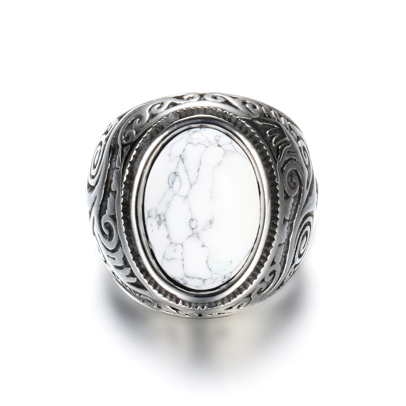 Bohemian unisex stainless steel ring with a vintage-style white stone centerpiece and intricate design.