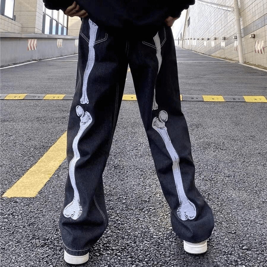 Bone print men's wide-leg jeans showcasing a unique skeletal design, perfect for alternative fashion enthusiasts.