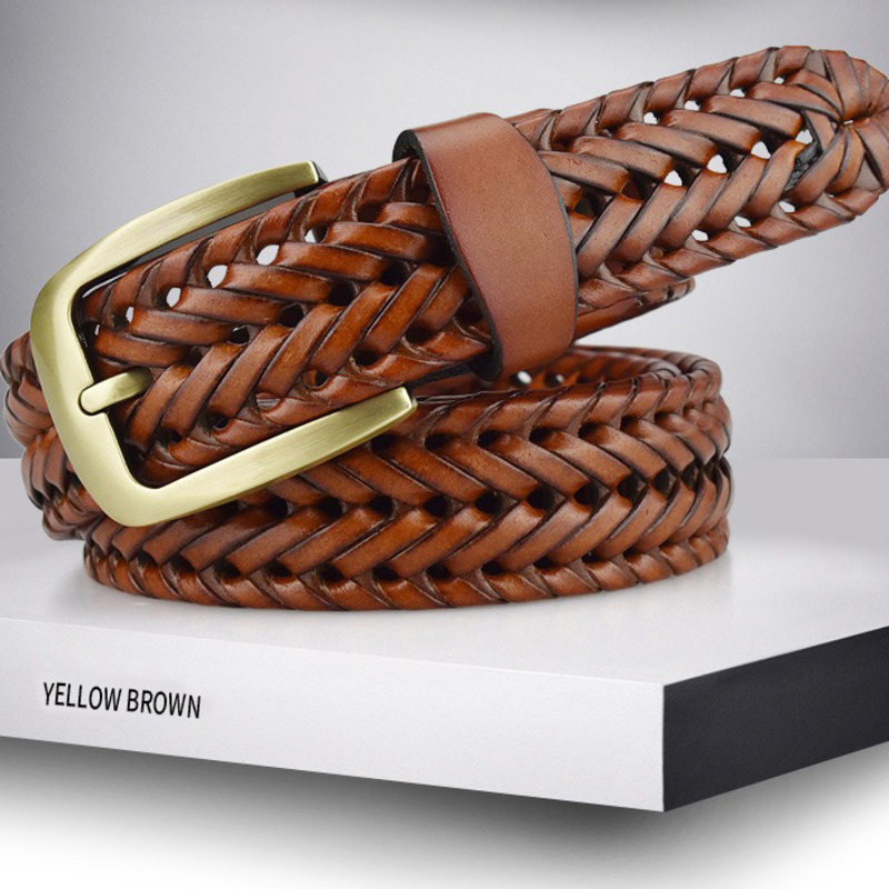 Braided leather belt for men and women in yellow brown color with metal buckle on display.