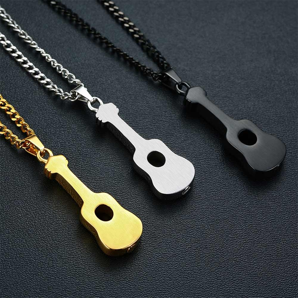 Stylish stainless steel necklaces featuring guitar pendants in gold, silver, and black finishes, perfect for casual jewelry lovers.