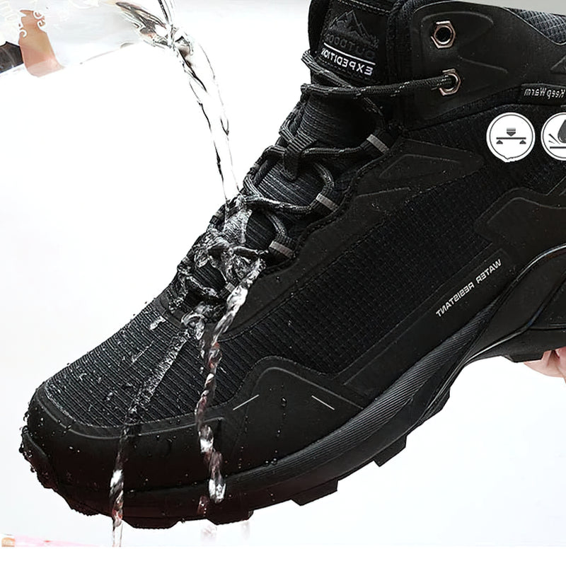 Black waterproof men's boots being splashed with water, showcasing their snow-proof and stylish design.