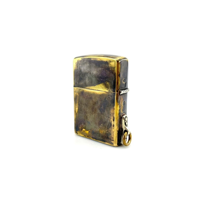 Brass portable lighter case with samurai skull design, a striking rock style accessory for everyday use.