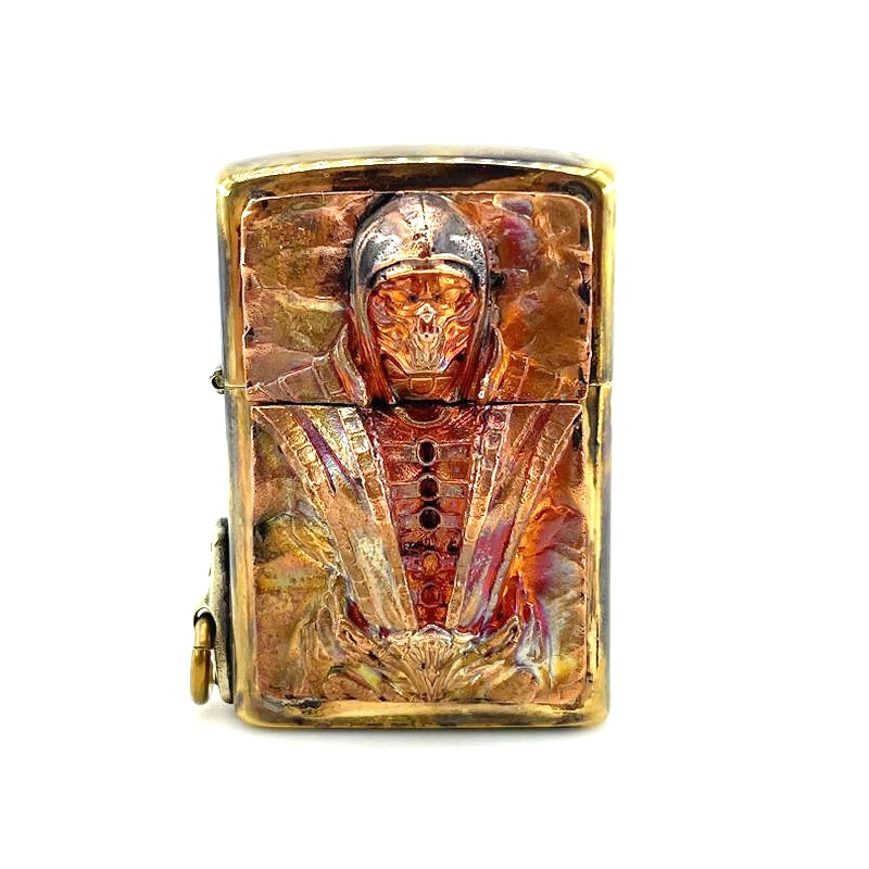 Brass lighter case featuring a striking samurai skull design, a stylish rock-style accessory for everyday use.