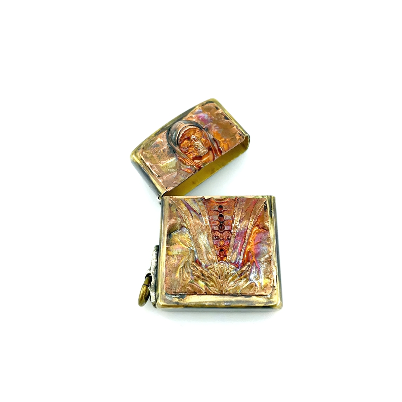Brass portable lighter case with intricate samurai skull design, perfect unisex rock accessory.