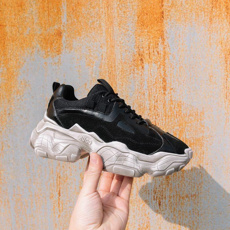 Breathable genuine leather women's black sneakers on a stylish platform, perfect for casual wear and everyday comfort.