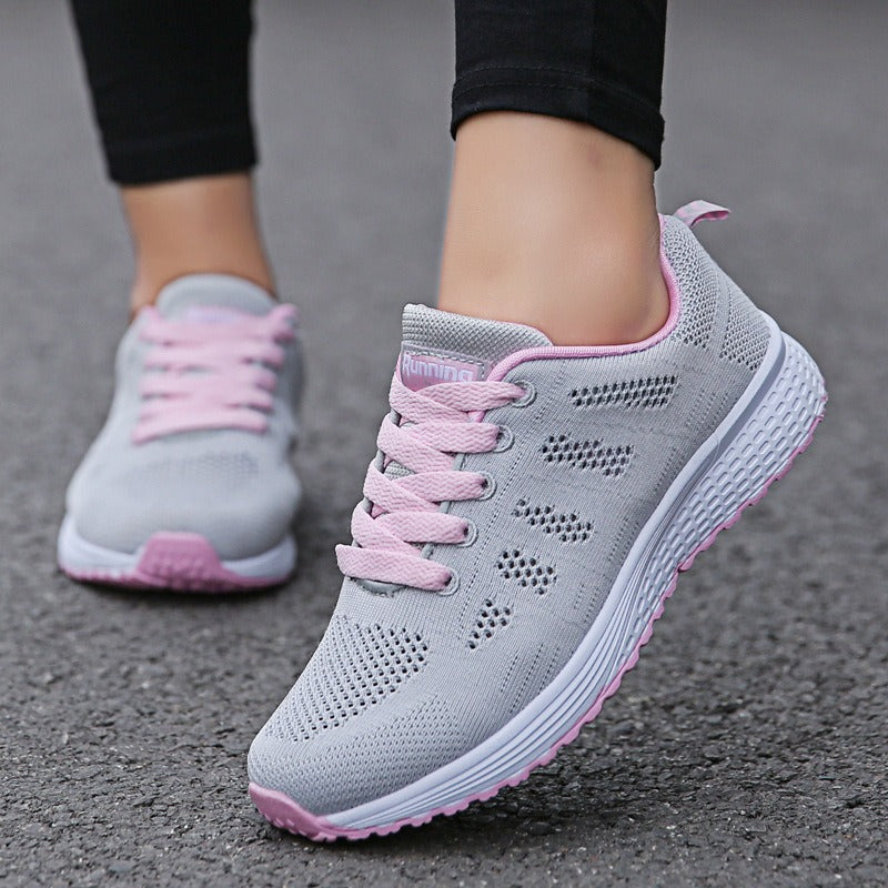 Women's breathable mesh lace-up flat sneakers in gray and pink, perfect for a stylish, comfortable look.