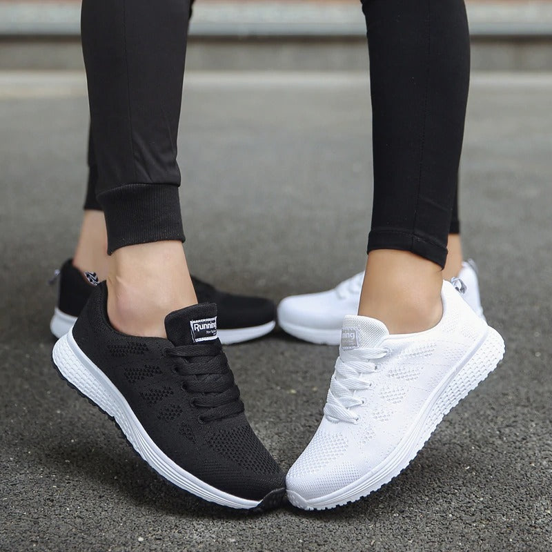 Breathable women's lace-up mesh sneakers in black and white, perfect for stylish comfort and aesthetic looks.