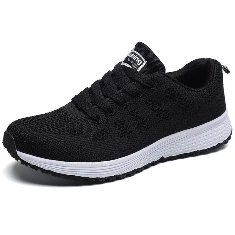 Stylish black breathable mesh lace-up flat sneakers for women, perfect for an active lifestyle and maximum comfort.