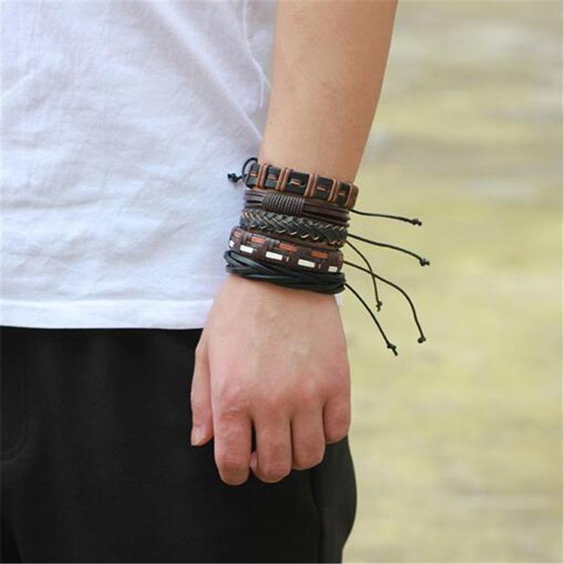 Brown and black leather braided wristband set of 6 on a person's wrist, perfect for adding rock style to any outfit.