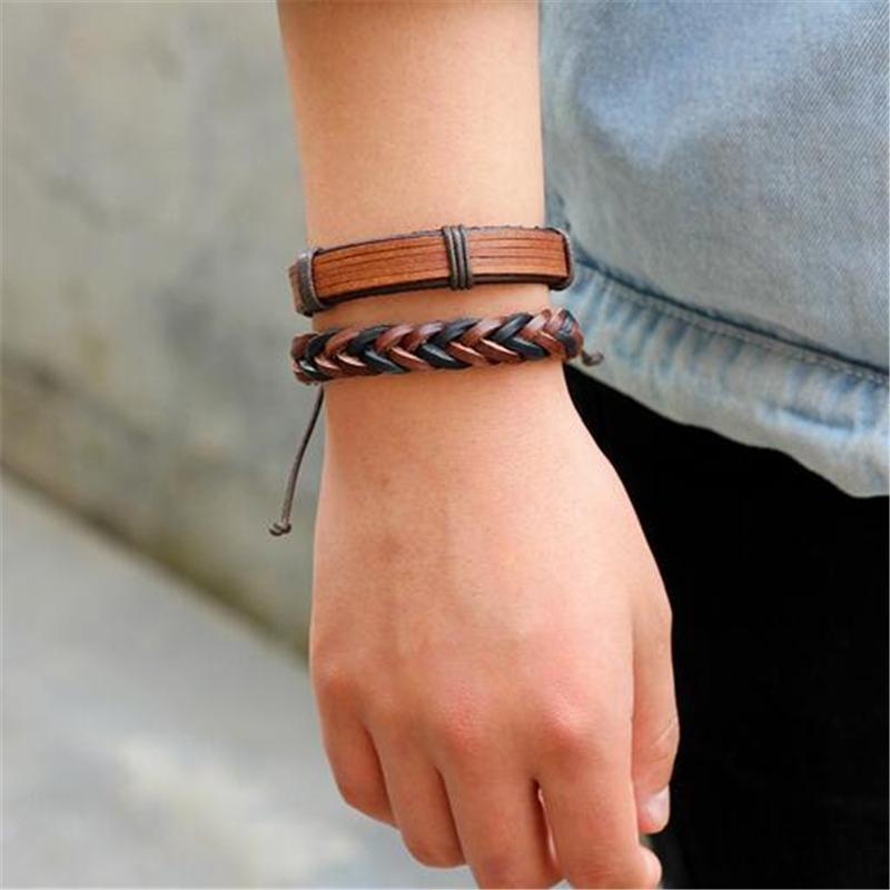 Stylish brown leather braided bracelet set on a wrist, showcasing rock-style fashion for both men and women.