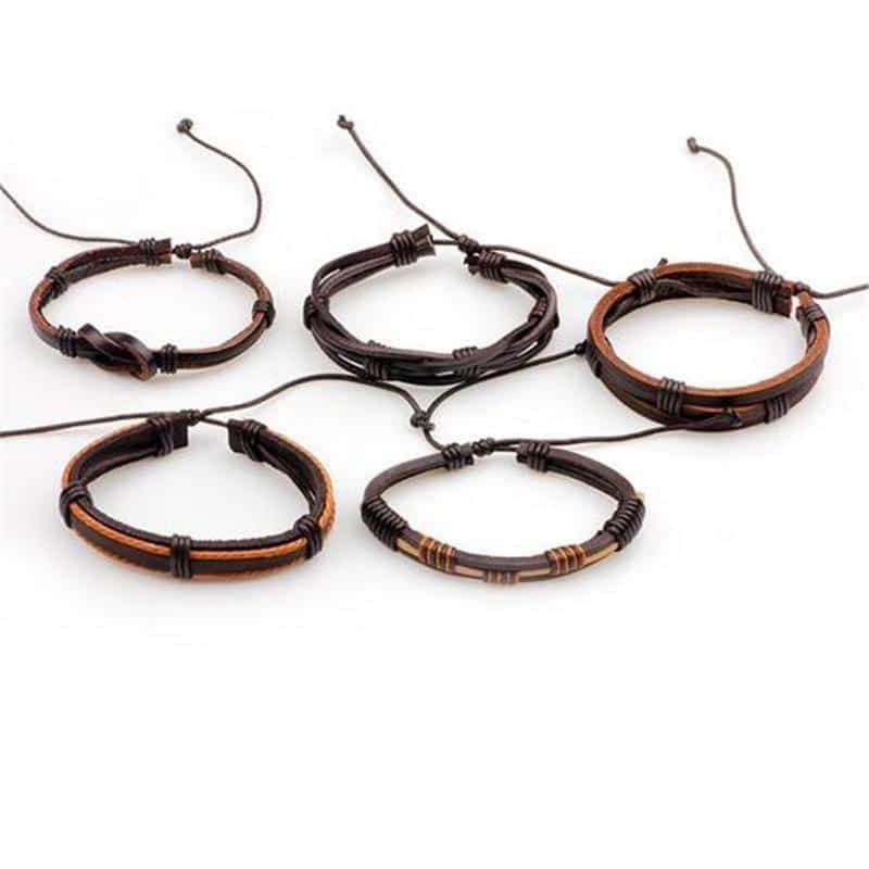 Set of 5 brown leather bracelets with braided designs, perfect for a stylish rock-inspired look for men.