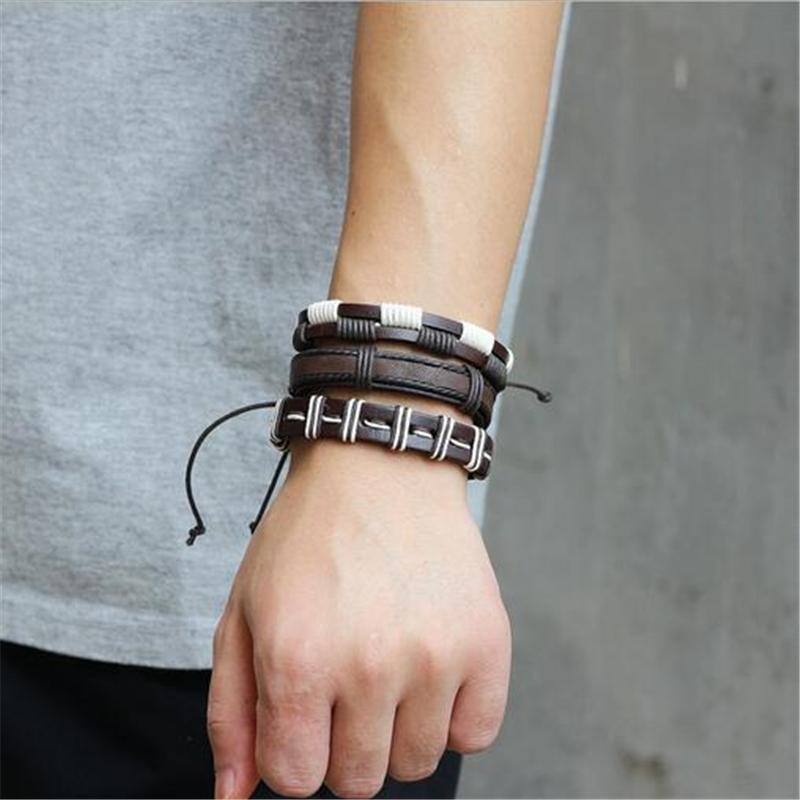 Men's brown and white leather bracelet set with rock style design, featuring braided and woven elements on a wrist.