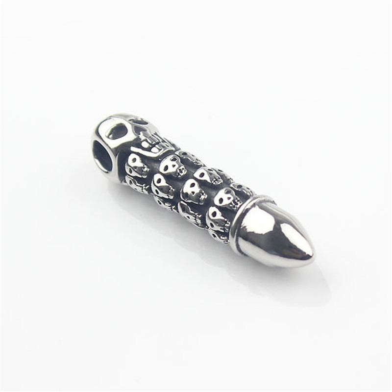 Bullet shape pendant necklace with skull engravings, perfect for alternative fashion lovers.