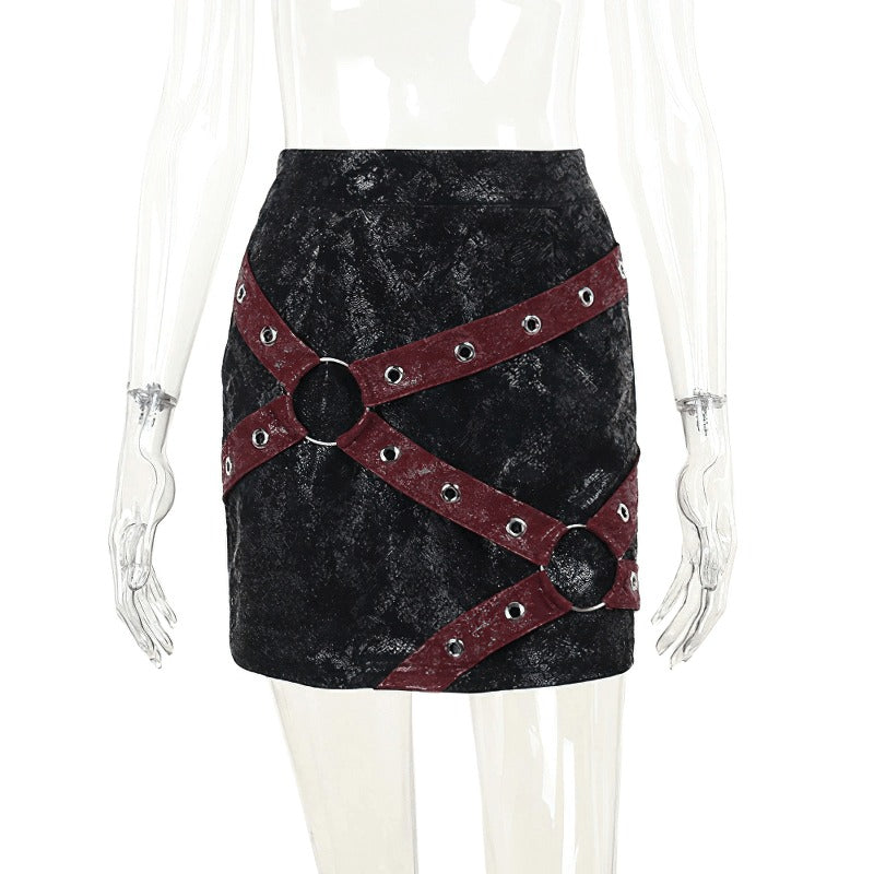 Stylish women's high-waisted mini skirt with rivet straps and rings, perfect for punk fashion lovers.