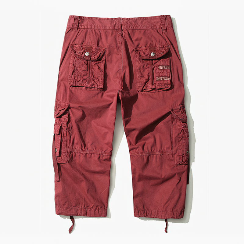 Back view of red camouflage loose cargo shorts for men, ideal for outdoor activities and warm seasons.