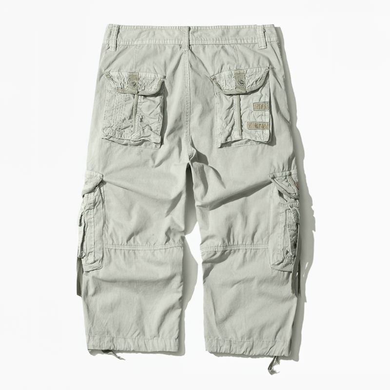 Back view of camouflage loose cargo shorts for men, featuring utility pockets and a comfortable fit for outdoor activities.