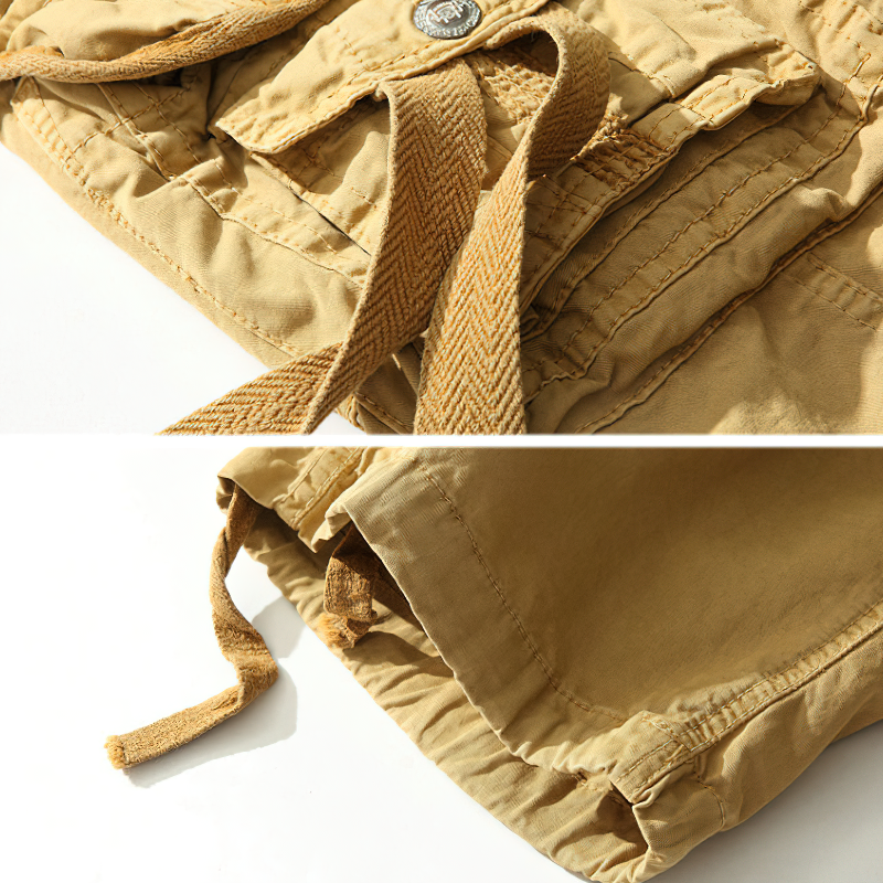 Close-up of lightweight beige cargo shorts with adjustable ties, perfect for outdoor activities and safari adventures.