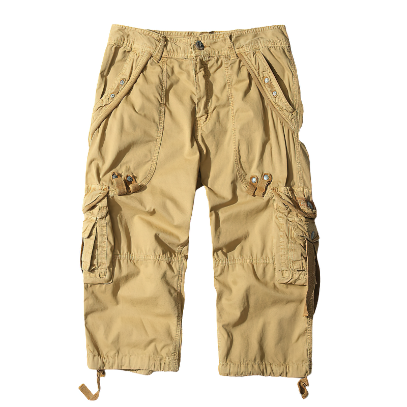 Men's beige cargo shorts with multiple pockets, perfect for outdoor adventures and casual wear in warm weather.
